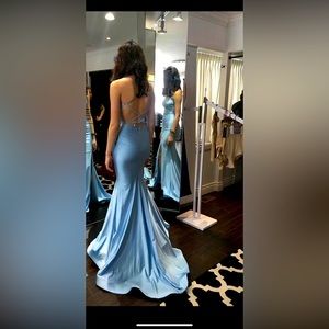 Evening dress in a beautiful sky blue colorway. Never worn or hemmed.